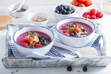 healthy berry smoothie bowl with strawberry blueberry raspberry and chia seed