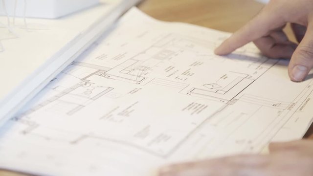 Architect examining blueprint