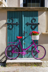 pink bike standing on the street