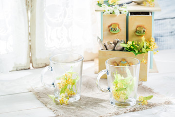 Healthy linden tea with honey on white table
