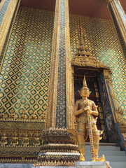 Golden giant guardian in front of gate at Wat Phra Kaew, Temple of the Emerald Buddha , Bangkok Thailand