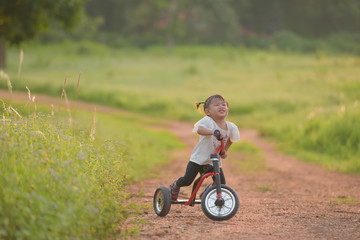  The girl is happy about cycling outside the home.