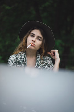 Stylish girl posing with cigarette