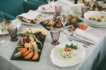 delicious salad on the table with glass of wine