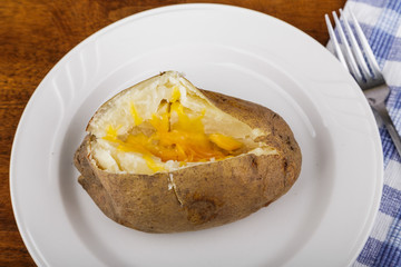 Cheesy Baked Potato on White Plate
