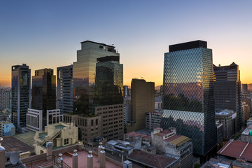 Obraz premium Modern buildings in the downtown of the city of Santiago de Chile at sunset, in Chile, South America