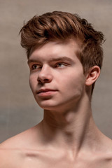 Naklejka premium The face of male ballet dancer over gray background