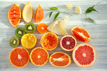 Beautiful composition with citrus fruits on wooden background