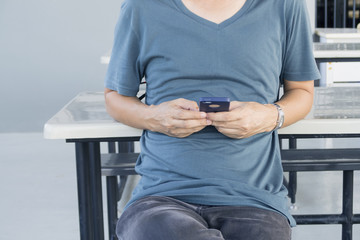 Young man using smart phone.