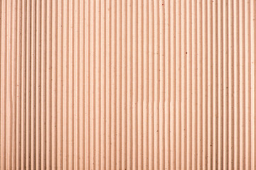 Close-up top view of blank brown striped cardboard texture