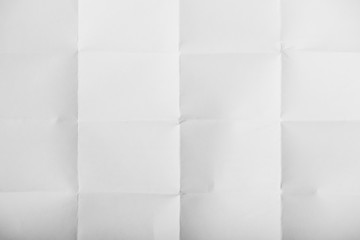 Close-up top view of white crumpled paper texture