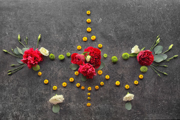Beautiful composition with flowers and leaves on gray background