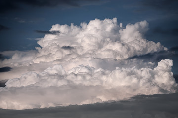 Fototapeta premium Cumulus cloud forming the storm at sunset