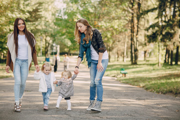 Obraz premium young family walking in the park