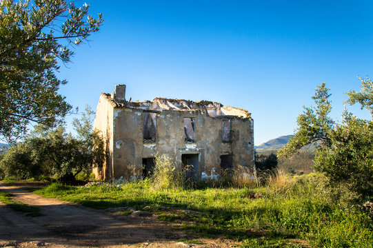 Old, left and damaged farmhouse in Andalusia, Spain on a day in spring