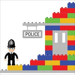 Toy police station. The designer of the building blocks and bricks of different colors with a figure of the British police.