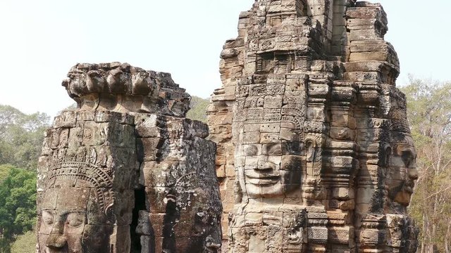 Tilt down of Ancient Bayon temple in Angkor Wat at Siem Reap, Cambodia.