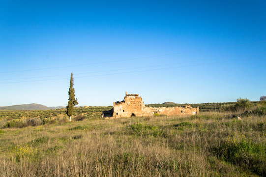 Old, abandoned and damaged farmhouse in Andalusia, Spain on a day in spring