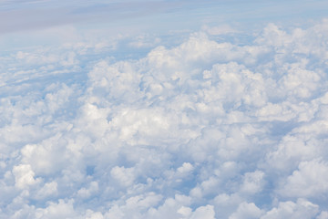 Beautiful cloudscape, on the heaven view over white fluffy clouds, freedom concept.