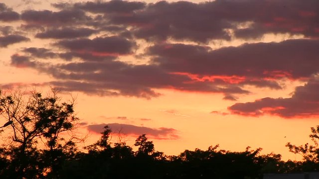 Slide sunset clouds dusk slowmotion red colors.