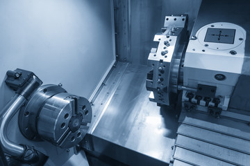 The CNC lathe or CNC turning machine in light blue scene.Precision manufacturing concept.