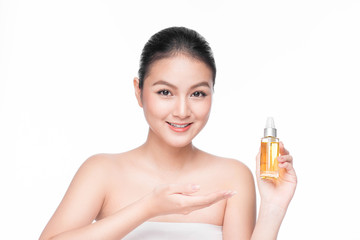 Obraz na płótnie Canvas Health, spa and beauty concept. Asian woman with perfect skin holding oil bottle