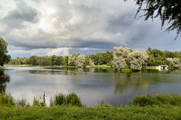 A picturesque view in Gatchina Palace Park on the beautiful nature and architecture. Summer landscape in the Gatchina, St. Petersburg, Russia.