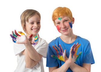 Family portrait of a brother and sister who stand side by side and smile and crossed their arms showing painted palms on a white background