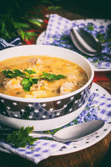 Soup with barley and chicken gizzards. Instagram style filtred image.