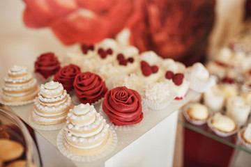 Cookies covered with red and white icing served on the table