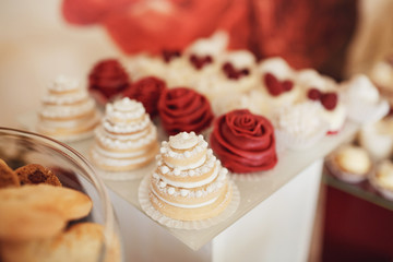 Cookies covered with red and white icing served on the table