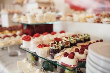 Cookies covered with red and white icing served on the table