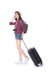 Travel concept. Full length portrait of asian pretty young woman in hat with backpack and valise