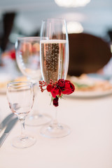 Champagne flute decorated with red flower