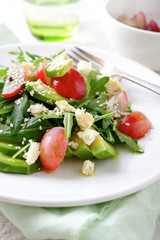 Fresh Avocado Salad with grapes, arugula, blu cheese and sesame