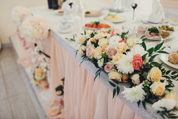 White and pink flowers lie on a table