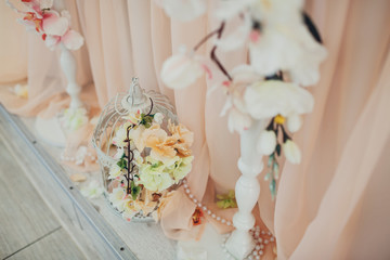 White orchids hang from pink table