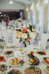 Colorful bouquet as a centerpiece of dinner table