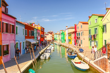 Naklejka na ściany i meble VENICE, ITALY - AUGUST 14,2011 : Colorful houses on Burano island, Venice Italy.