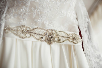 Belt of wedding dress decorated with crystals and pearls