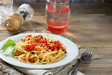 Pasta on the plate in wooden table