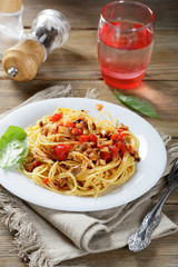 Pasta with fried mushrooms and tomatoes on a plate