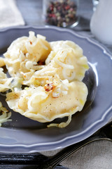 Dumplings with potatoes and fried onions