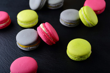 Assorted macaroon on slate background