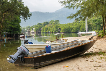 Obraz premium The small boat parked in a small canal at the mangrove forest.Thailand.