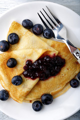 Pancakes with fresh blueberries and jam