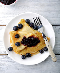 Pancakes on a plate with blueberry jam