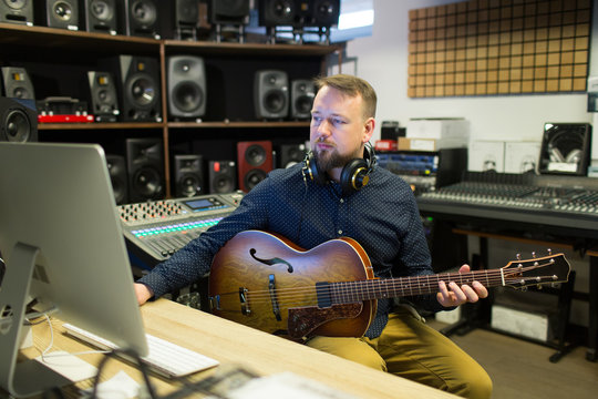 Man recording music in studio