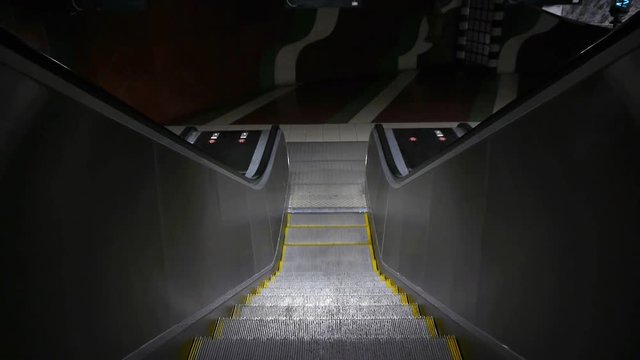 Point of view shot of escalator moving down