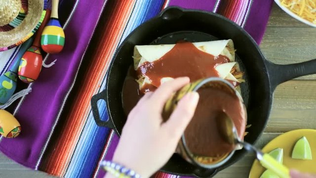 Time-lapse.Preparing homemade chicken enchiladas in cast iron frying pan
